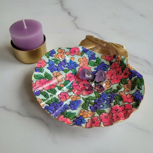 Pink & Purple Floral shell trinket dish with gold edging. A decorative holder for rings, earrings, and jewelry on a vanity, dresser, or nightstand.