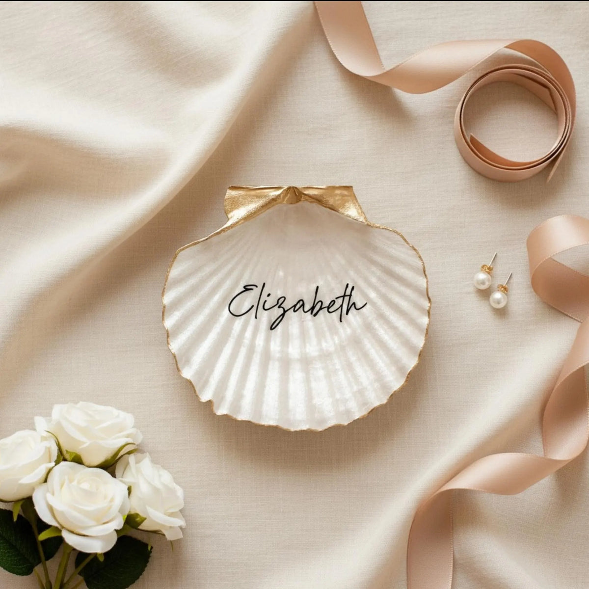 Personalized pearl-white scallop shell ring dish with the name Elizabeth